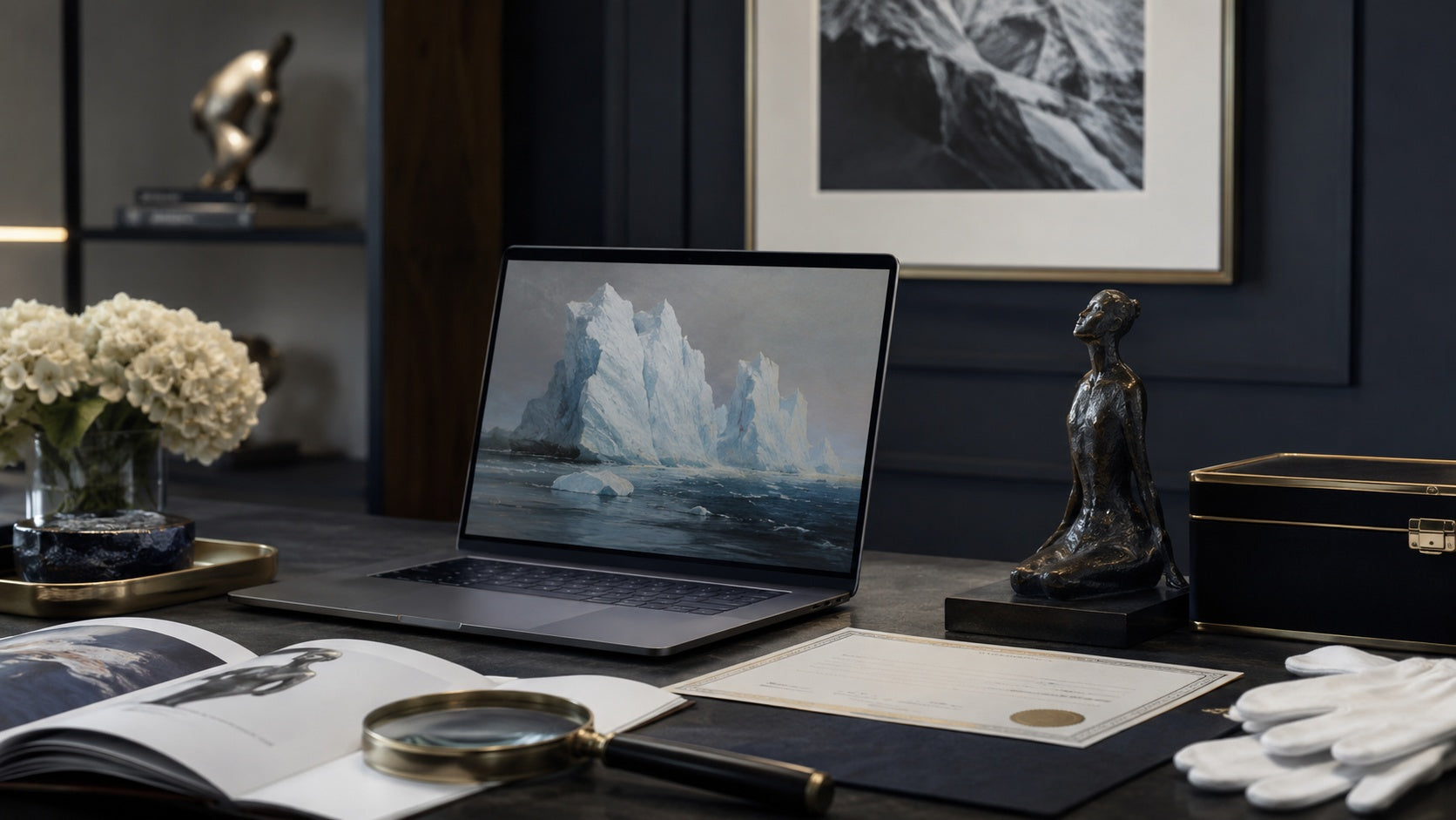 Collector browsing fine art online on a laptop in a gallery setting