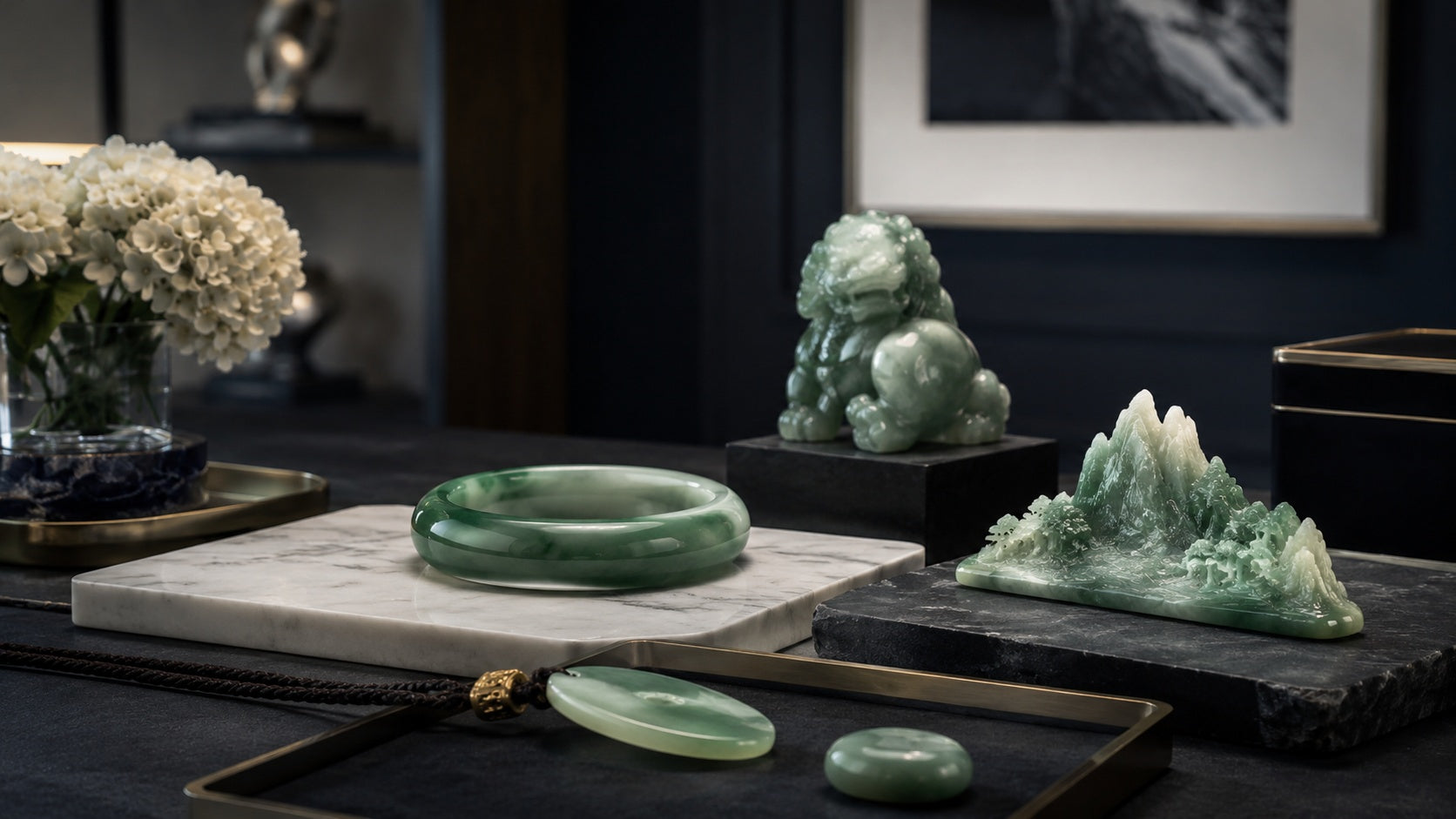 Carved translucent green jadeite jade pendant held to the light